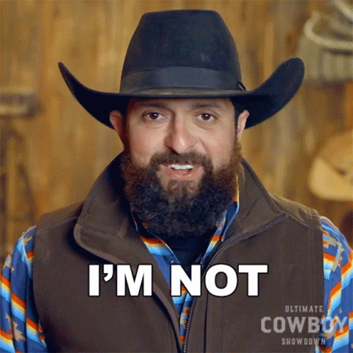 A Man With A Beard Is Wearing A Cowboy Hat And Vest And Says I 'M Not GIF