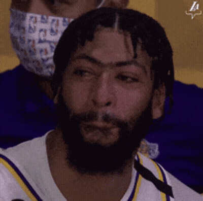 A Man With A Beard Is Wearing A Face Mask GIF