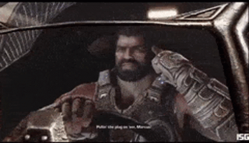 A Man With A Beard Is Wearing A Glove That Says ' Sg ' On It . GIF