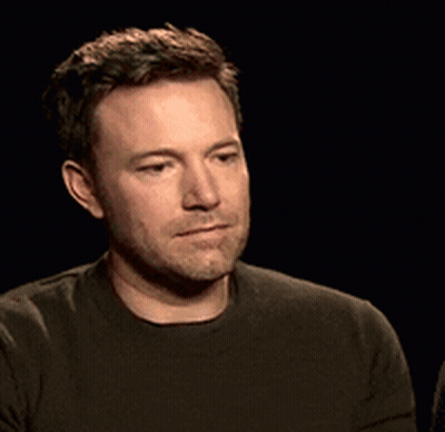 A Man With A Beard Is Wearing A Green Shirt GIF