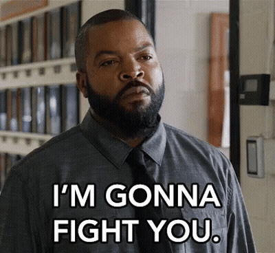A Man With A Beard Is Wearing A Grey Shirt And Tie And Says I 'M Gonna Fight You . GIF