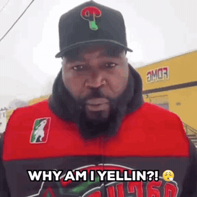 A Man With A Beard Is Wearing A Hat And A Jacket And Says Why Am I Yellin ? GIF