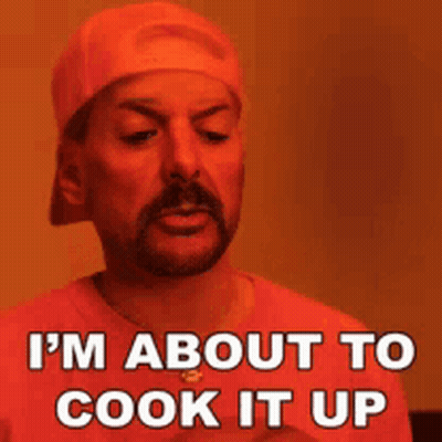 A Man With A Beard Is Wearing A Hat And A Red Shirt And Says I 'M About To Cook It Up GIF