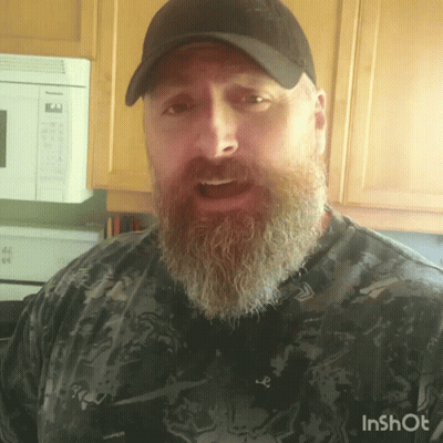 A Man With A Beard Is Wearing A Hat And A Shirt That Says Inshot On It GIF