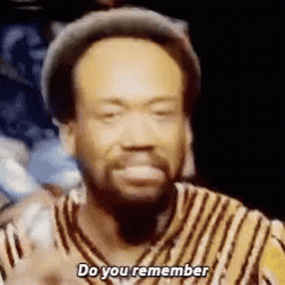 A Man With A Beard Is Wearing A Hat And A Striped Shirt And Saying `` Do You Remember '' . GIF