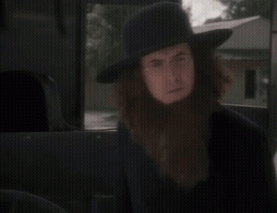 A Man With A Beard Is Wearing A Hat GIF