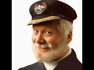 A Man With A Beard Is Wearing A Hat That Says Captain On It GIF