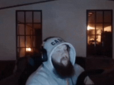 A Man With A Beard Is Wearing A Hoodie That Says Ca On It GIF