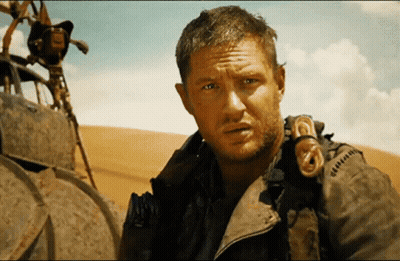 A Man With A Beard Is Wearing A Jacket That Says ' G ' On It GIF