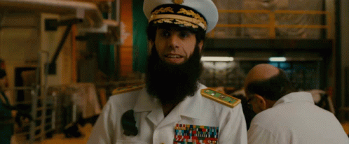 Bearded Man In Navy Uniform With US Navy Badge GIF