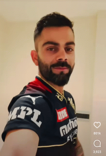 A Man With A Beard Is Wearing A Mpl Shirt GIF