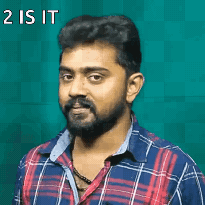 A Man With A Beard Is Wearing A Plaid Shirt And Has The Words 2 Is It On His Face GIF
