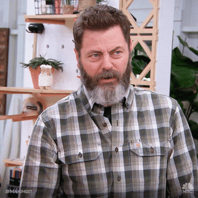 A Man With A Beard Is Wearing A Plaid Shirt With The Hashtag #Makingit On It GIF