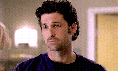 A Man With A Beard Is Wearing A Purple Shirt And A Black Shirt GIF