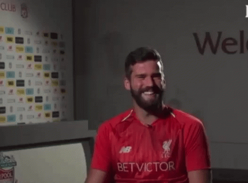 A Man With A Beard Is Wearing A Red Shirt That Says Bet Victor On It GIF