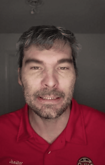 A Man With A Beard Is Wearing A Red Shirt That Says Go Fuck Yourself On It GIF