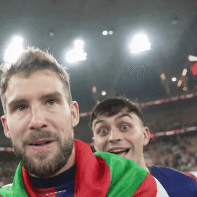 A Man With A Beard Is Wearing A Red White And Blue Jacket With The Word Adidas On The Front GIF