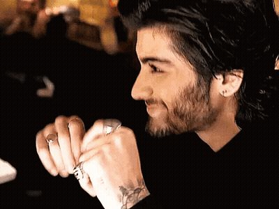 A Man With A Beard Is Wearing A Ring On His Finger GIF