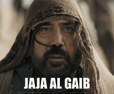 A Man With A Beard Is Wearing A Scarf Around His Head And The Words Jaja Al Gaib Are Above Him GIF