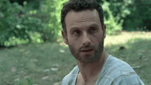 A Man With A Beard Is Wearing A Shirt That Says ' A.m.c. Hd ' On It . GIF
