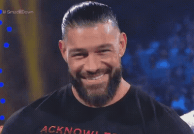 A Man With A Beard Is Wearing A Shirt That Says Acknowledgment GIF