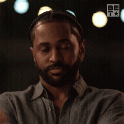 A Man With A Beard Is Wearing A Shirt That Says Be On The Bottom GIF