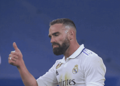 A Man With A Beard Is Wearing A Shirt That Says Emirates On It GIF