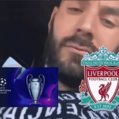 A Man With A Beard Is Wearing A Shirt That Says Liverpool Football Club GIF