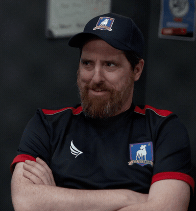 A Man With A Beard Is Wearing A Shirt That Says No On It GIF