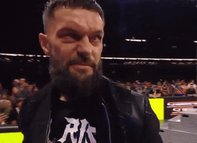 A Man With A Beard Is Wearing A Shirt That Says Rks GIF