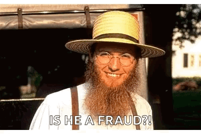 A Man With A Beard Is Wearing A Straw Hat And Suspenders . GIF