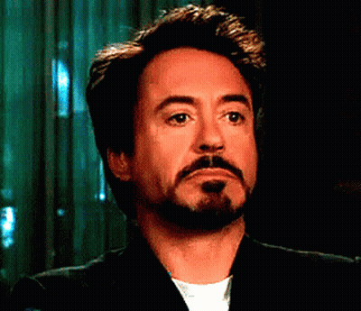 A Man With A Beard Is Wearing A Suit And White Shirt GIF