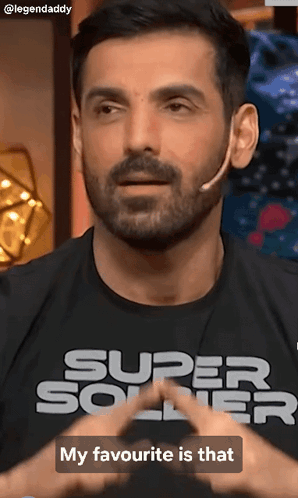 A Man With A Beard Is Wearing A Super Soldier T-Shirt GIF