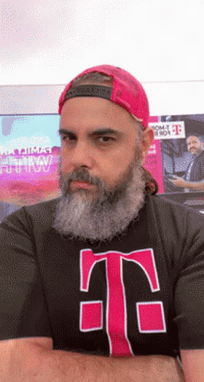 A Man With A Beard Is Wearing A T-Mobile T-Shirt GIF