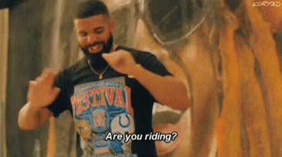 A Man With A Beard Is Wearing A T-Shirt That Says `` Are You Riding ? '' . GIF