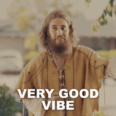 A Man With A Beard Is Wearing A Very Good Vibe Outfit GIF