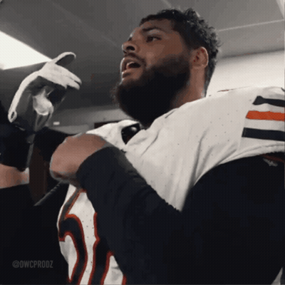 A Man With A Beard Is Wearing A White Jersey With The Number 25 On It GIF