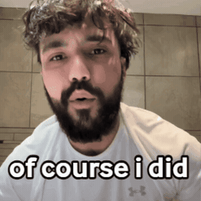 A Man With A Beard Is Wearing A White Shirt And Says Of Course I Did GIF