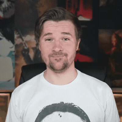 A Man With A Beard Is Wearing A White Shirt GIF