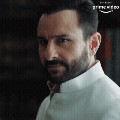 A Man With A Beard Is Wearing A White Shirt That Says Amazon Prime Video On The Bottom GIF
