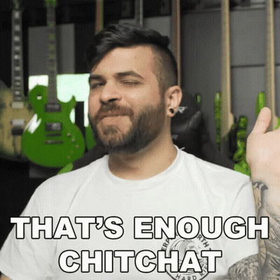 A Man With A Beard Is Wearing A White Shirt That Says That 'S Enough Chitchat On It GIF