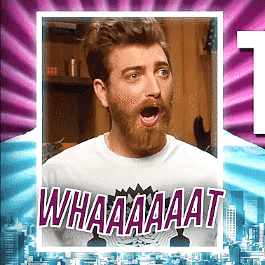 A Man With A Beard Is Wearing A White Shirt That Says Whaaaaat GIF