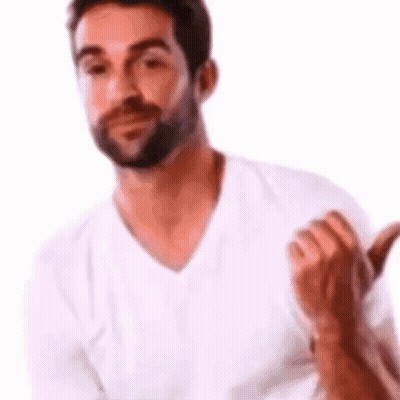 A Man With A Beard Is Wearing A White T-Shirt And Giving A Thumbs Up . GIF