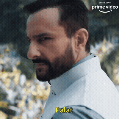 A Man With A Beard Is Wearing A White Vest And Has The Word Palat Written On His Chest GIF