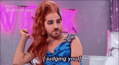 A Man With A Beard Is Wearing A Wig And A Blue Dress And Saying I Judging You . GIF