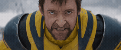 A Man With A Beard Is Wearing A Yellow And Blue Armor GIF