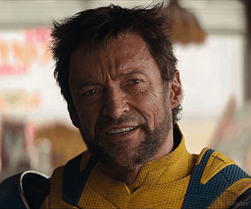 A Man With A Beard Is Wearing A Yellow And Blue Uniform GIF