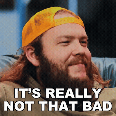 A Man With A Beard Is Wearing A Yellow Hat And Says " It 'S Really Not That Bad " GIF