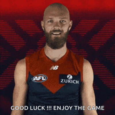 A Man With A Beard Is Wearing An Afl Jersey And Says Good Luck !!! Enjoy The Game . GIF