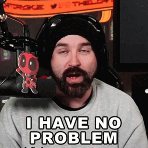 A Man With A Beard Is Wearing Headphones And A Beanie And Says I Have No Problem GIF